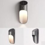 Applique murale solaire anthracite avec détecteur, design moderne, fixée sur mur blanc, éclaire vers le bas.