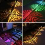 Lampes LED solaires extérieures projetant des motifs lumineux colorés sur allée et terrasse la nuit