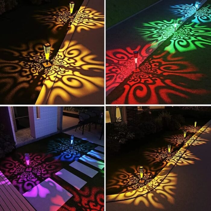 Lampes LED solaires extérieures projetant des motifs lumineux colorés sur allée et terrasse la nuit