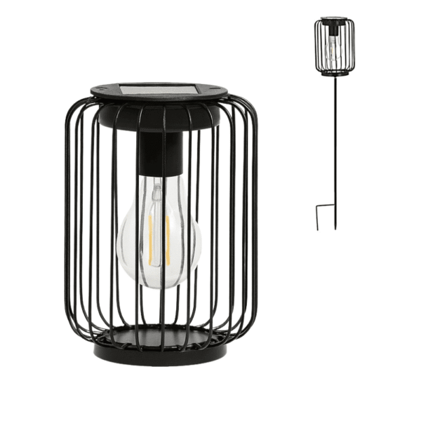 Lampe solaire LED noire avec cage en métal, utilisable posée ou avec piquet pour extérieur.